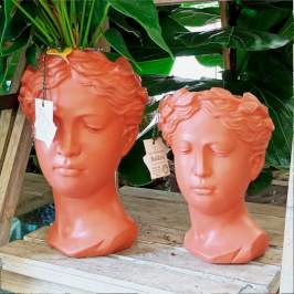 Vasi decorativi a forma di testa per arredamento color arancio - salmone